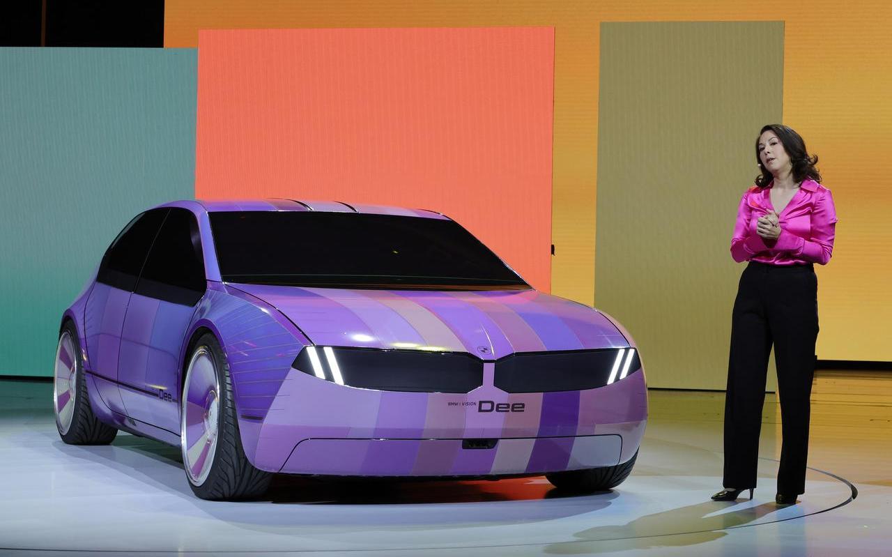 LAS VEGAS, NEVADA - JANUARY 04: BMW project manager Stella Clarke introduces the color-changing ability of the BMW i Vision Dee (Digital Emotional Experience) concept EV sport sedan during a keynote address by Chairman of the Board of Management of BMW AG Oliver Zipse at CES 2023 at The Pearl concert theater at Palms Casino Resort on January 04, 2023 in Las Vegas, Nevada. CES, the world's largest annual consumer technology trade show, runs from January 5-8 and features about 3,100 exhibitors showing off their latest products and services to more than 100,000 attendees. (Photo by Ethan Miller/Getty Images) LAS VEGAS, NEVADA - JANUARY 04: BMW project manager Stella Clarke introduces the color-changing ability of the BMW i Vision Dee (Digital Emotional Experience) concept EV sport sedan during a keynote address by Chairman of the Board of Management of BMW AG Oliver Zipse at CES 2023 at The Pearl concert theater at Palms Casino Resort on January 04, 2023 in Las Vegas, Nevada. CES, the world's largest annual consumer technology trade show, runs from January 5-8 and features about 3,100 exhibitors showing off their latest products and services to more than 100,000 attendees. (Photo by Ethan Miller/Getty Images)