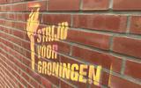 Strijd voor Groningen op de muur.